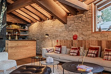 A living room with a couch and a book titled provence
