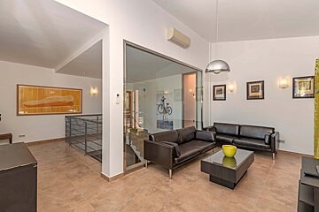 A living room with a couch and a coffee table