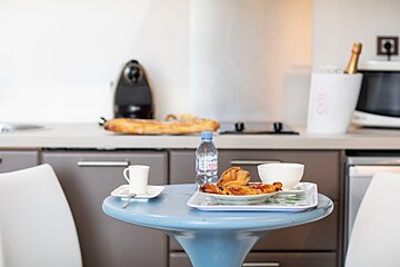 A bottle of evian water sits on a table