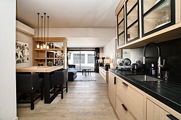 A kitchen with a sink and a table with the word provence on it