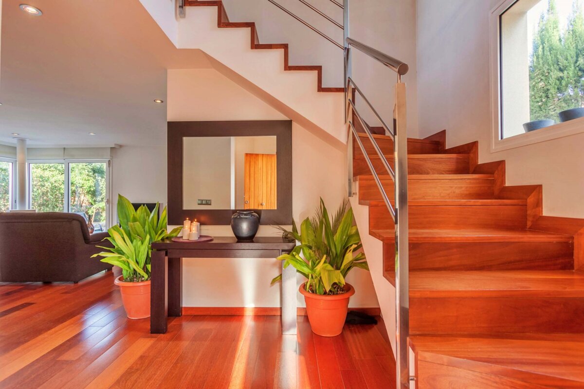 A wooden staircase leading up to the second floor of a house