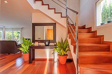 A wooden staircase leading up to the second floor of a house