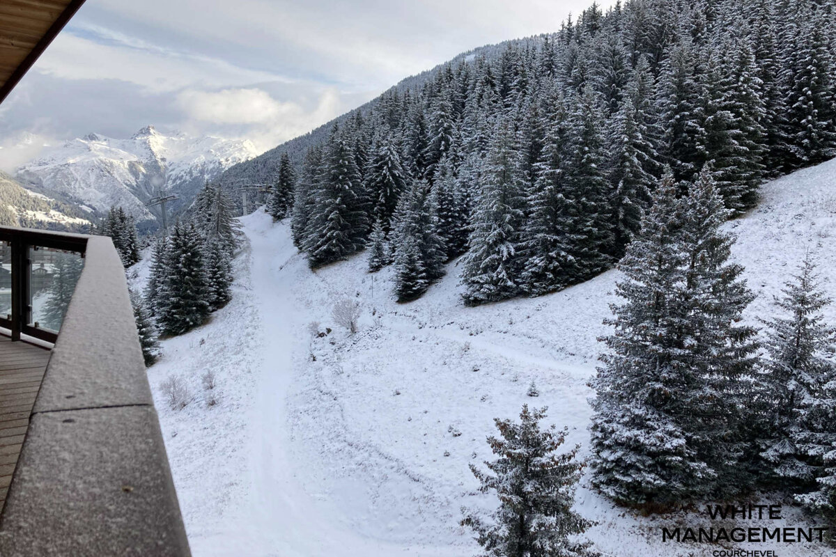A bathroom with a blue counter top and a bathtub