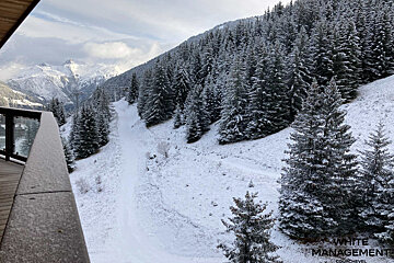 A bathroom with a blue counter top and a bathtub