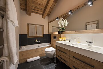 A bathroom with a sink toilet and bathtub
