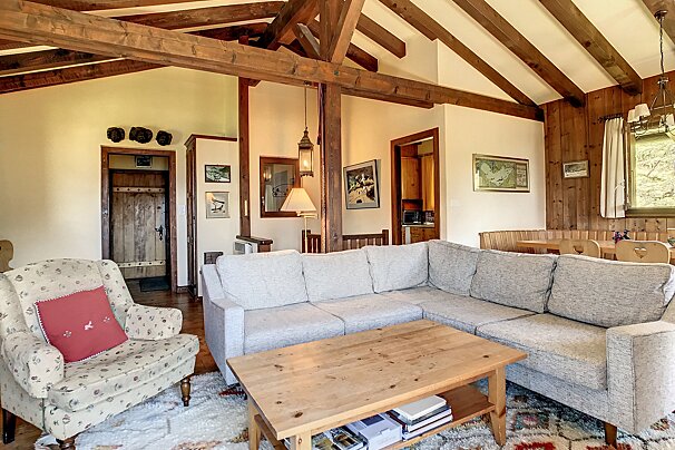 A living room with a couch a chair and a coffee table