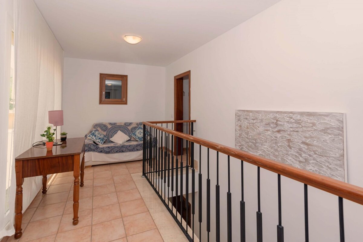 A living room with a couch and a table