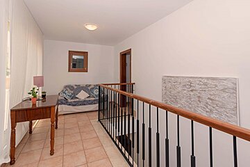 A living room with a couch and a table