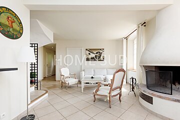 A living room with a fireplace and a sign that says wellington club