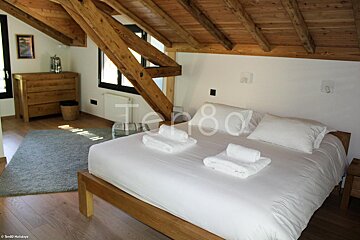 A bedroom with a bed and a sign that says terra80