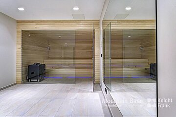A room with a sauna and a sign that says mountain base