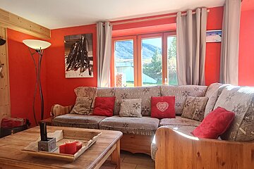 A living room with a couch and a coffee table