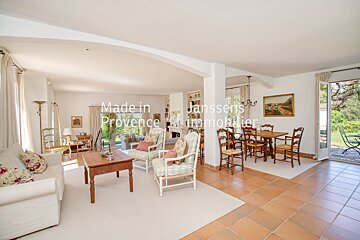 A living room and dining room with the words made in janssens provence written on the wall