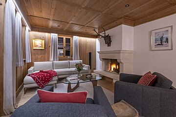 A living room with a fireplace and a couch