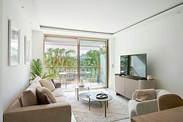 A living room with a couch and a flat screen tv