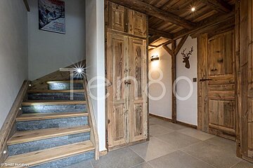 A wooden staircase leading up to the second floor