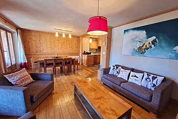 A living room with a couch a chair and a coffee table