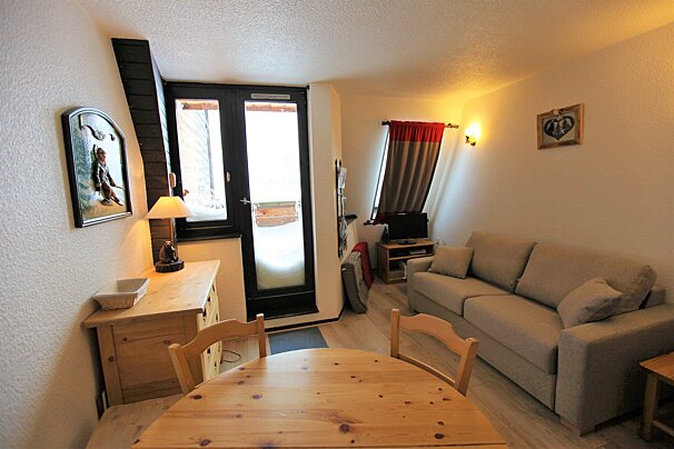 A living room with a couch and a table