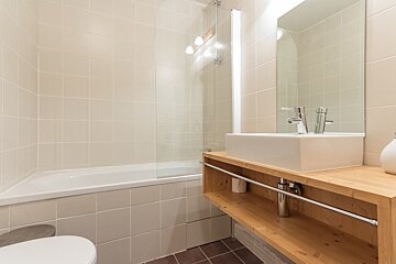 A bathroom with a sink and a bathtub