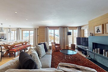 A living room with a couch and a fireplace