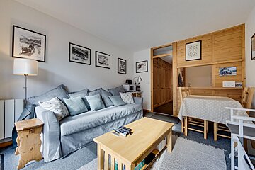 A living room with a couch and a table
