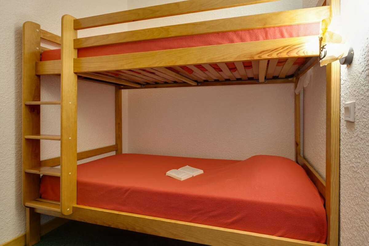 A bunk bed with a book on top of it