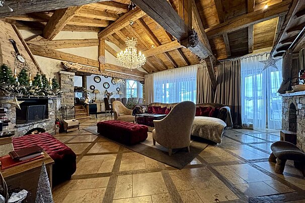 A living room filled with furniture and a fireplace