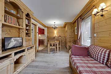 A living room with a couch and a table