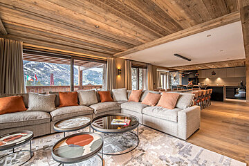 A living room with a couch and two coffee tables