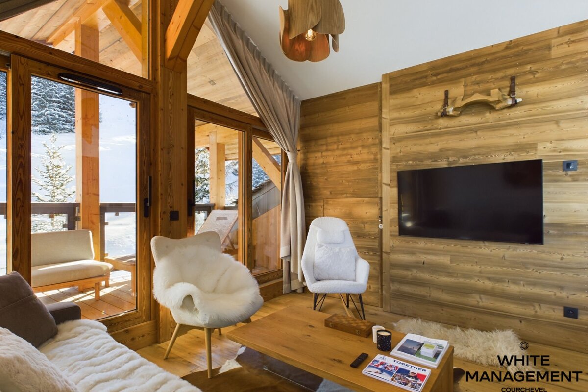 A living room with a flat screen tv that says swiss on it