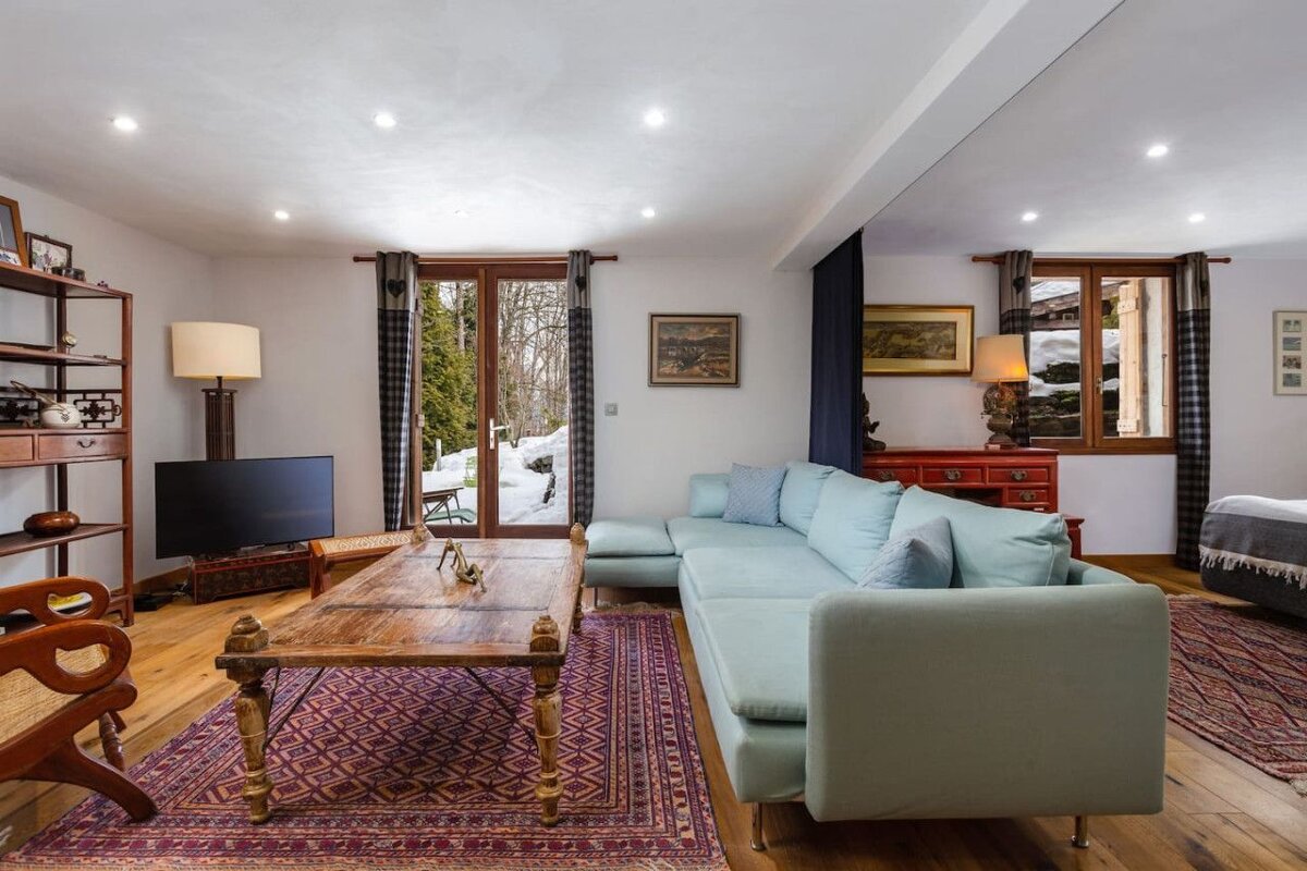 A living room with a couch and a television