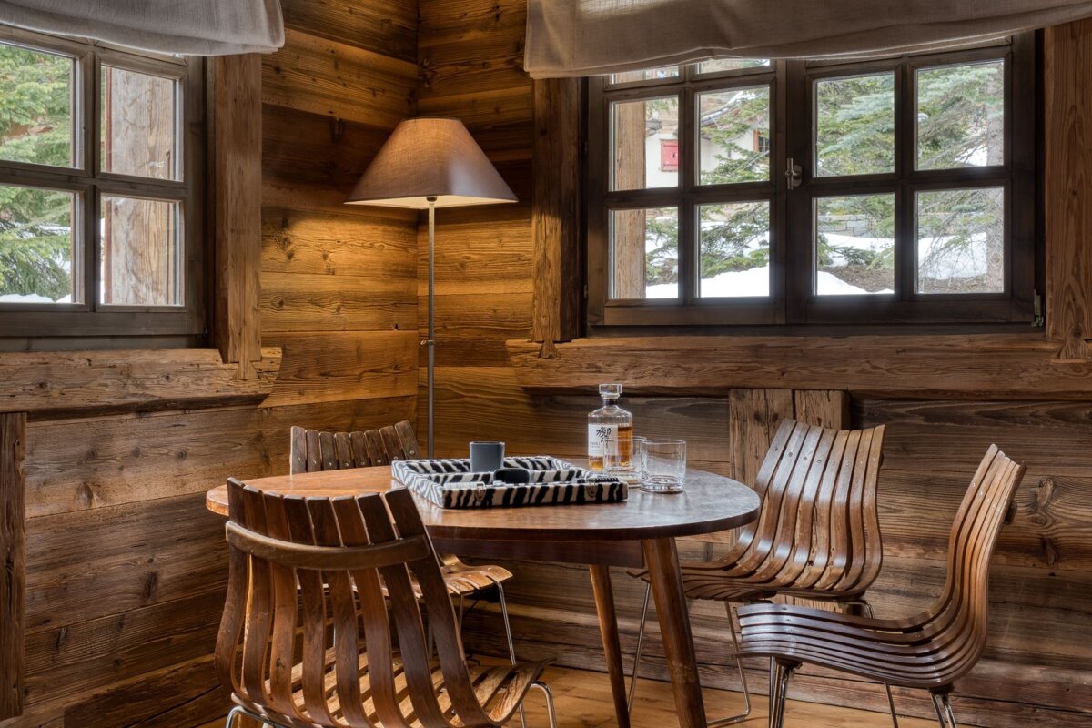 A bottle of vodka sits on a wooden table