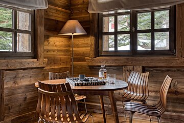 A bottle of vodka sits on a wooden table
