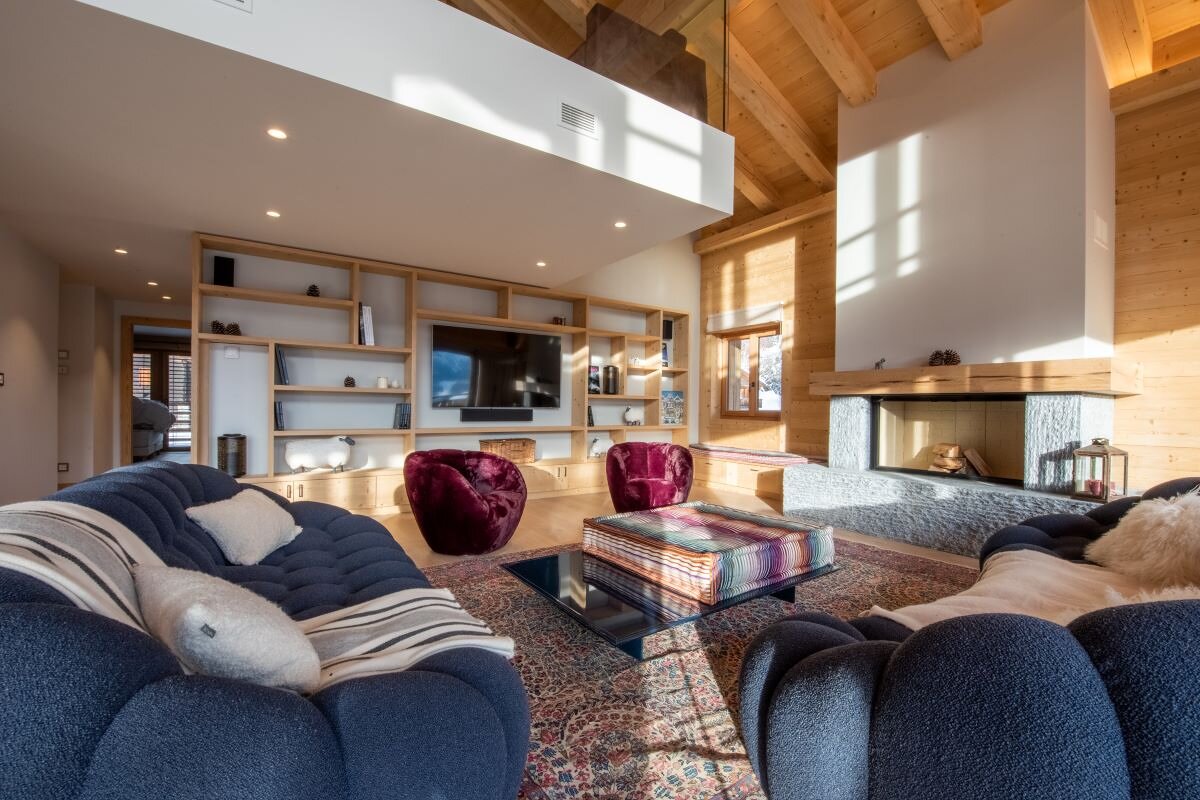 A living room filled with furniture and a fireplace