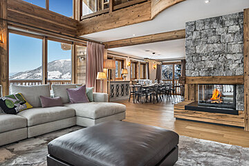 A living room with a fireplace and a couch