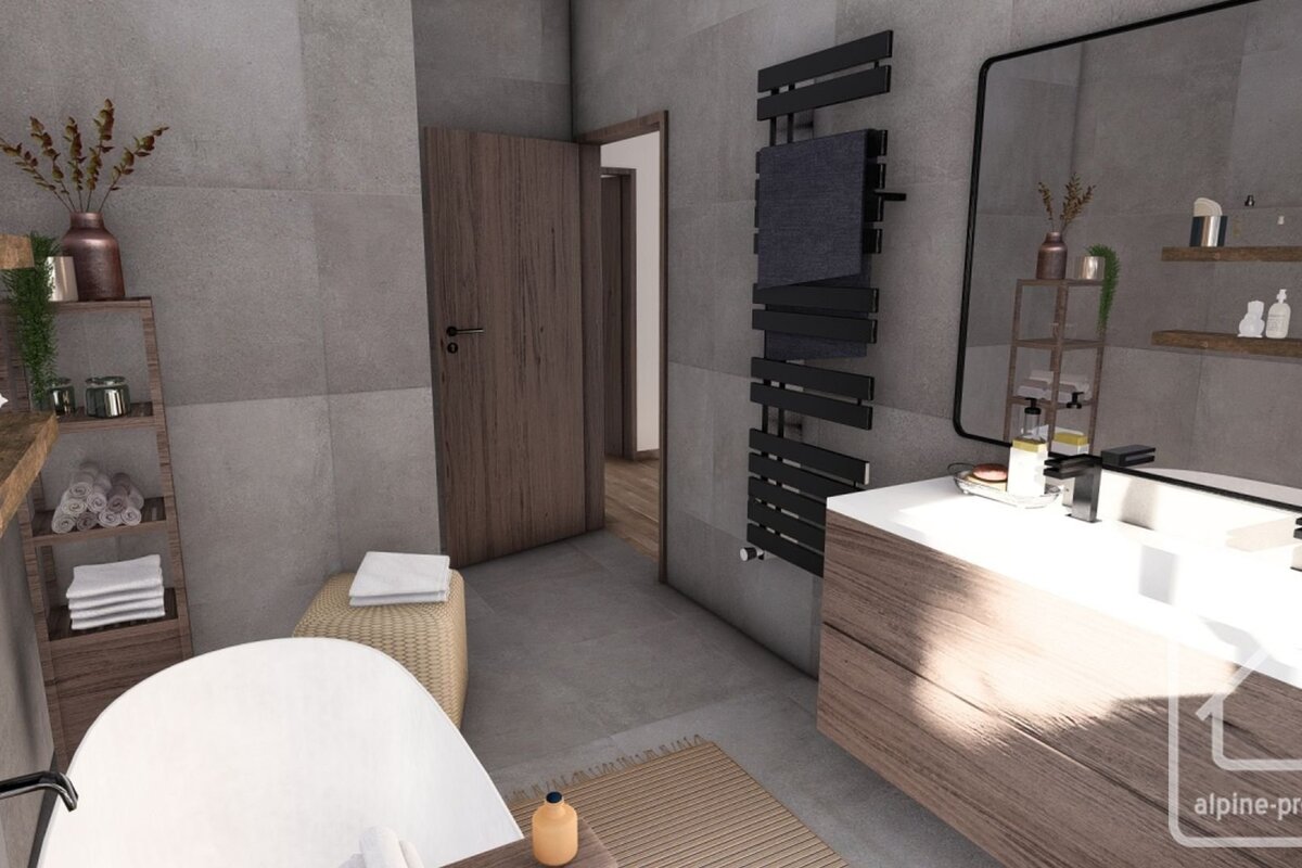 A modern gray-tiled bathroom featuring wood accents, a white tub, a vanity with a large mirror, and a black heated towel rack.