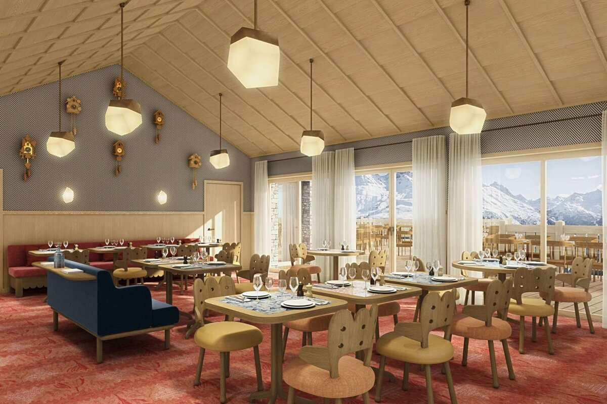 A cozy, modern restaurant with unique wooden furniture, cuckoo clocks on the wall, a red carpet, and large windows showing snowy mountains.