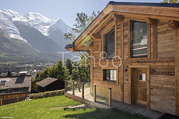 A wooden house with the word tango on it