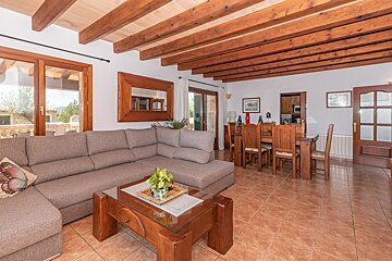 A living room with a sectional couch and a coffee table
