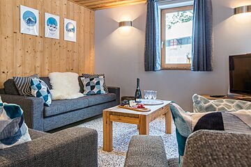 A living room with a couch and a coffee table