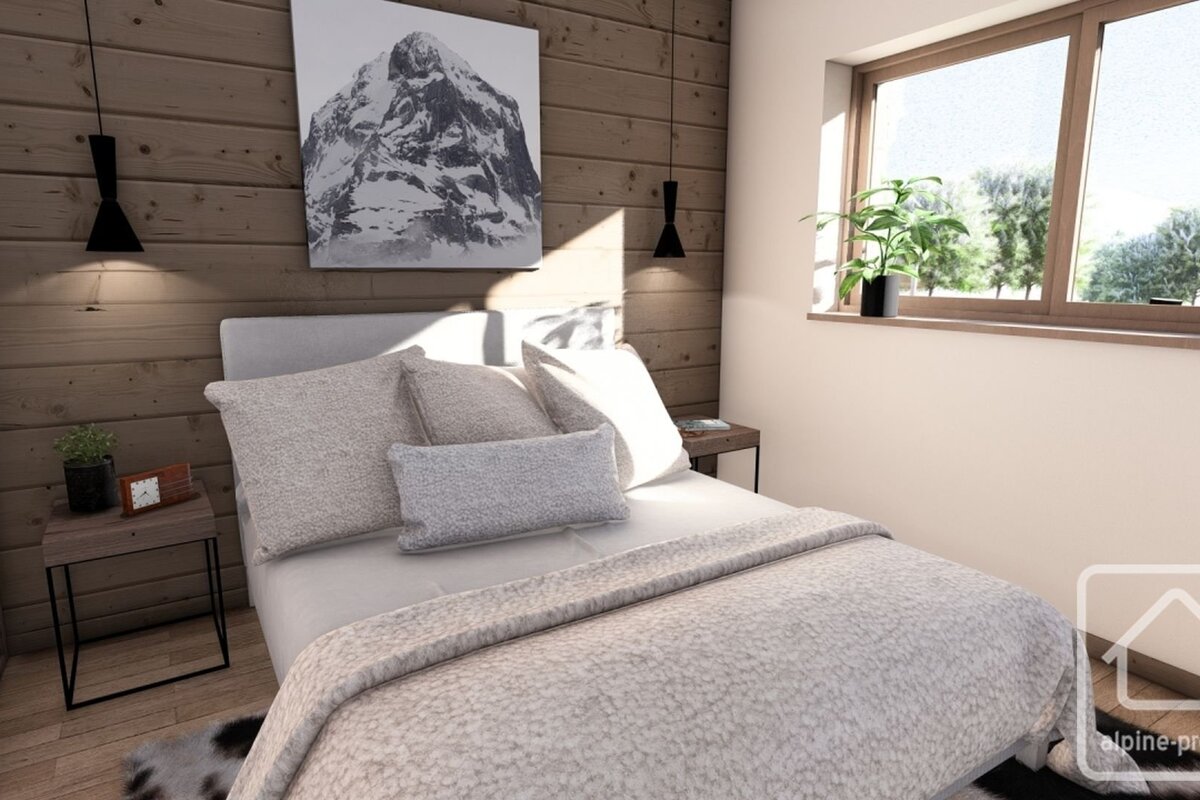 A modern, cozy bedroom with wood paneled walls, a large bed with gray bedding, a mountain art print, and a bright window.