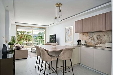 A smeg toaster sits on a counter in a kitchen