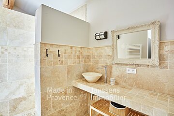 A bathroom with a sink and a mirror that says made in provence