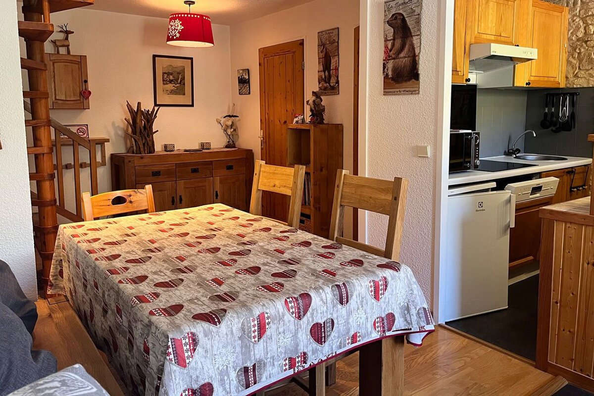 A table with a table cloth with hearts on it