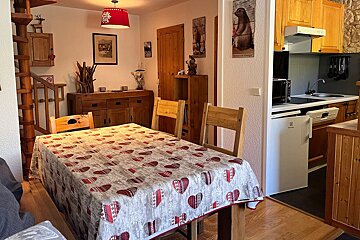 A table with a table cloth with hearts on it