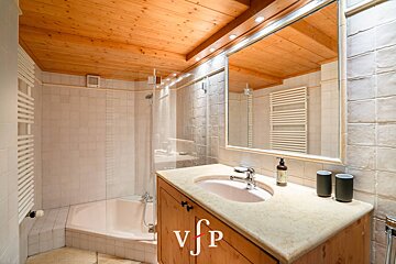 A bathroom with a sink a mirror and a sign that says vjp