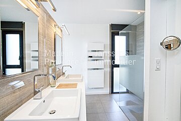 A bathroom with two sinks and a mirror that says made in provence