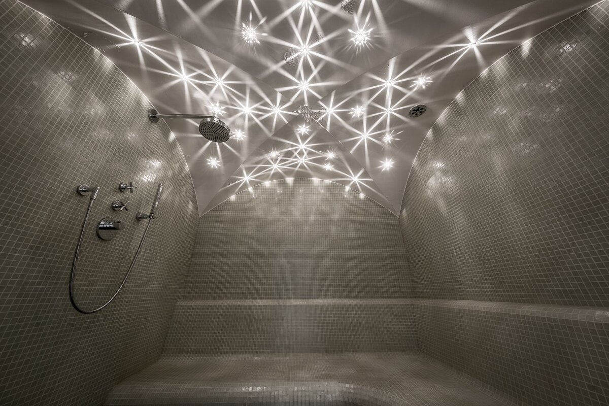 A shower with a ceiling that looks like a starry sky