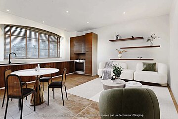 A rendering of a living room with a couch and a table