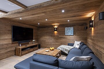 A living room with a couch and a flat screen tv